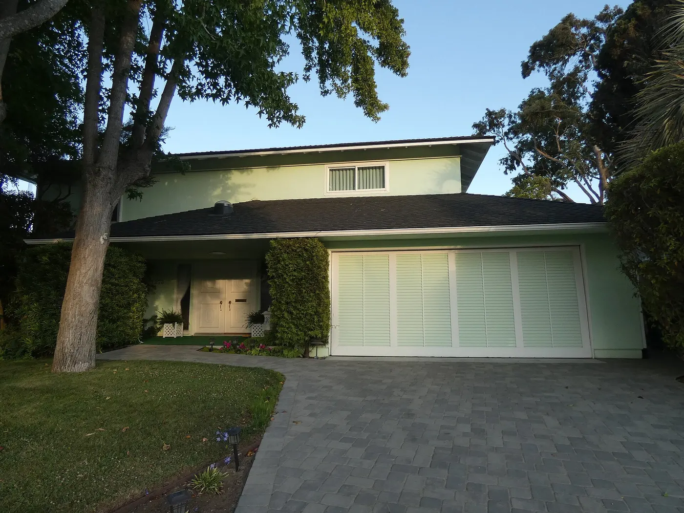 A clean driveway and garage after a home cleanout